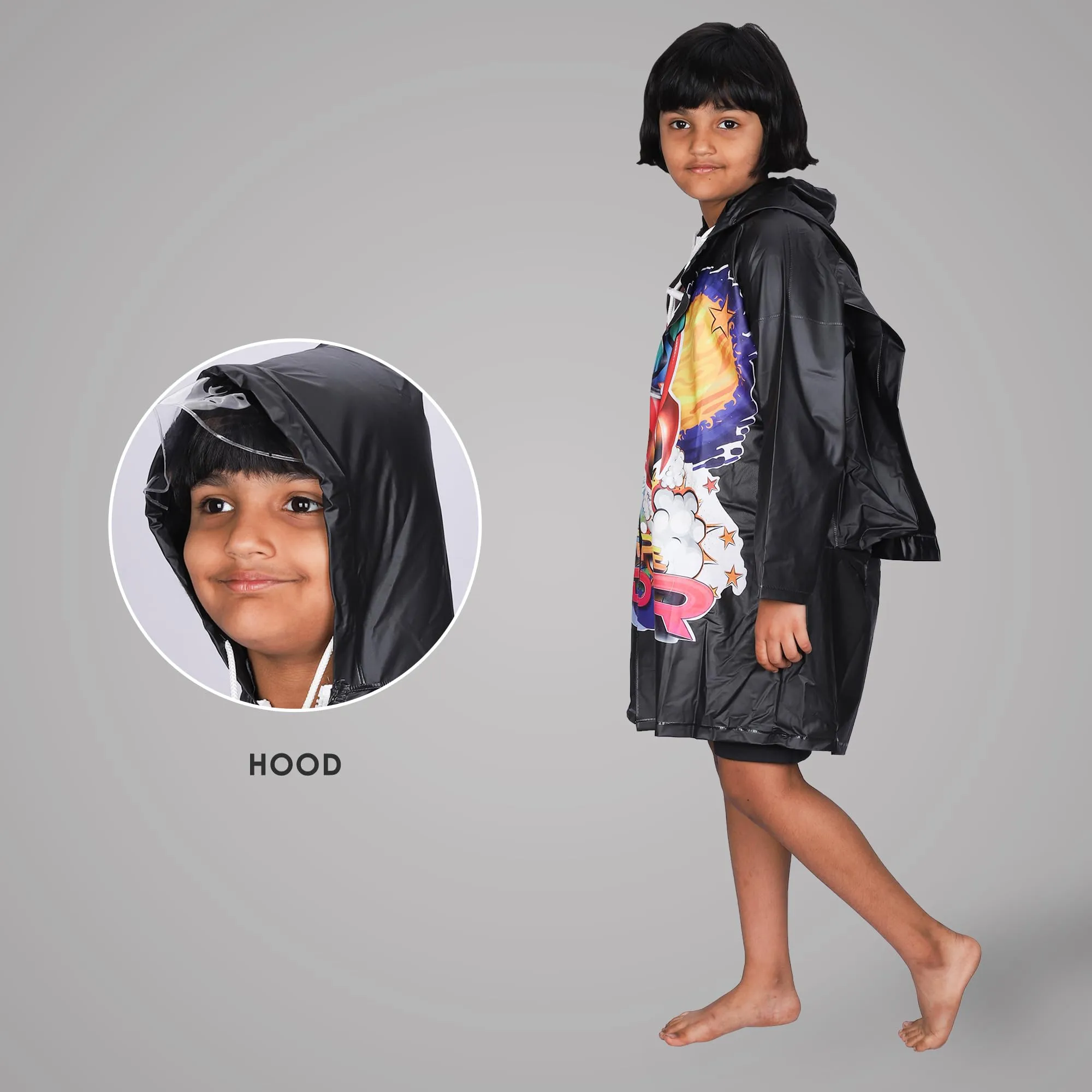 THE CLOWNFISH Toon Caper Series Kids Waterproof PVC Longcoat with Adjustable Hood & Extra Space for Backpack/Schoolbag Holding. Printed Plastic Pouch. Kid Age-5-6 years (Jet Black)